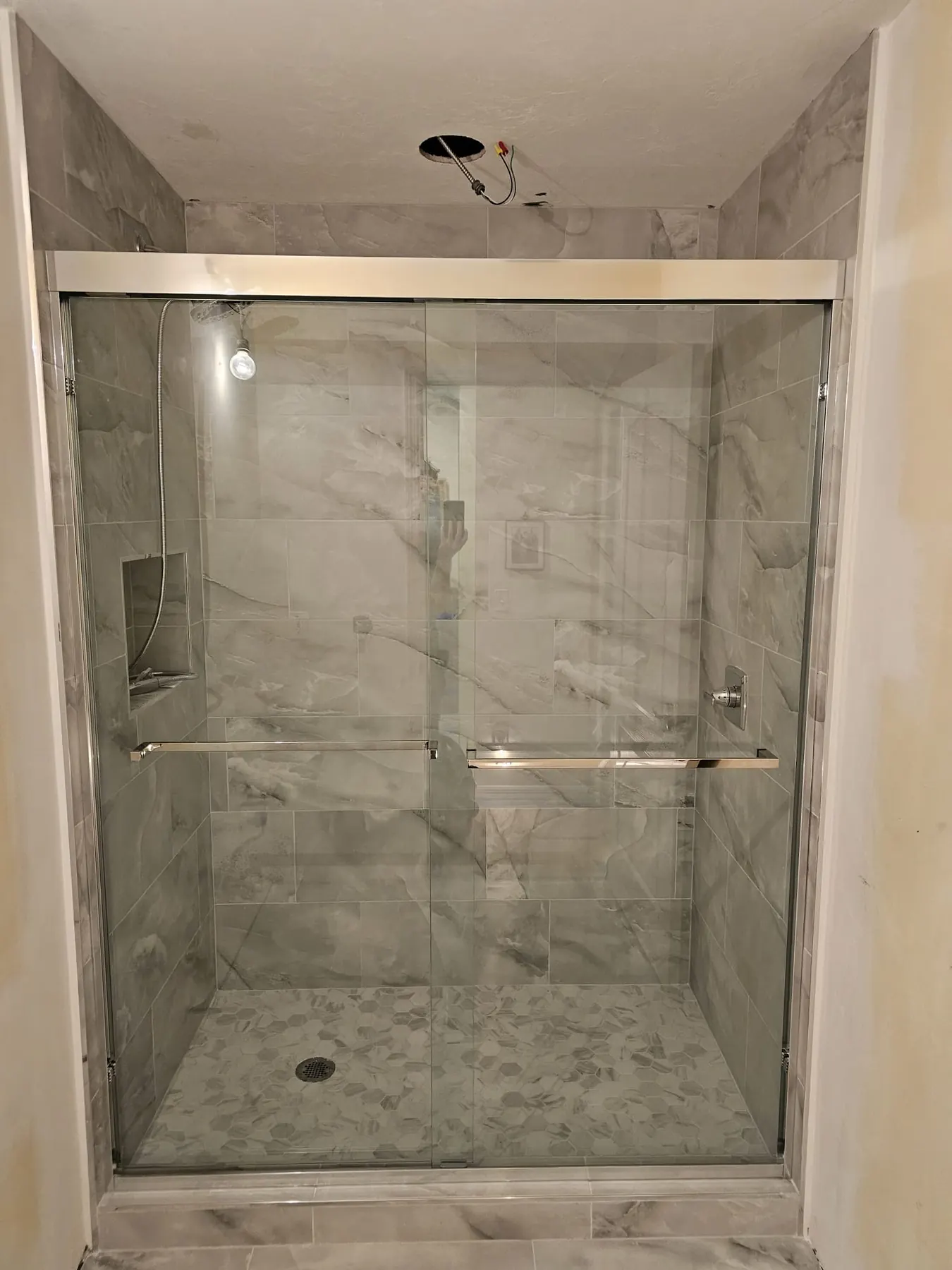 after framed sliding shower glass with chrome hardware in Southwest Florida