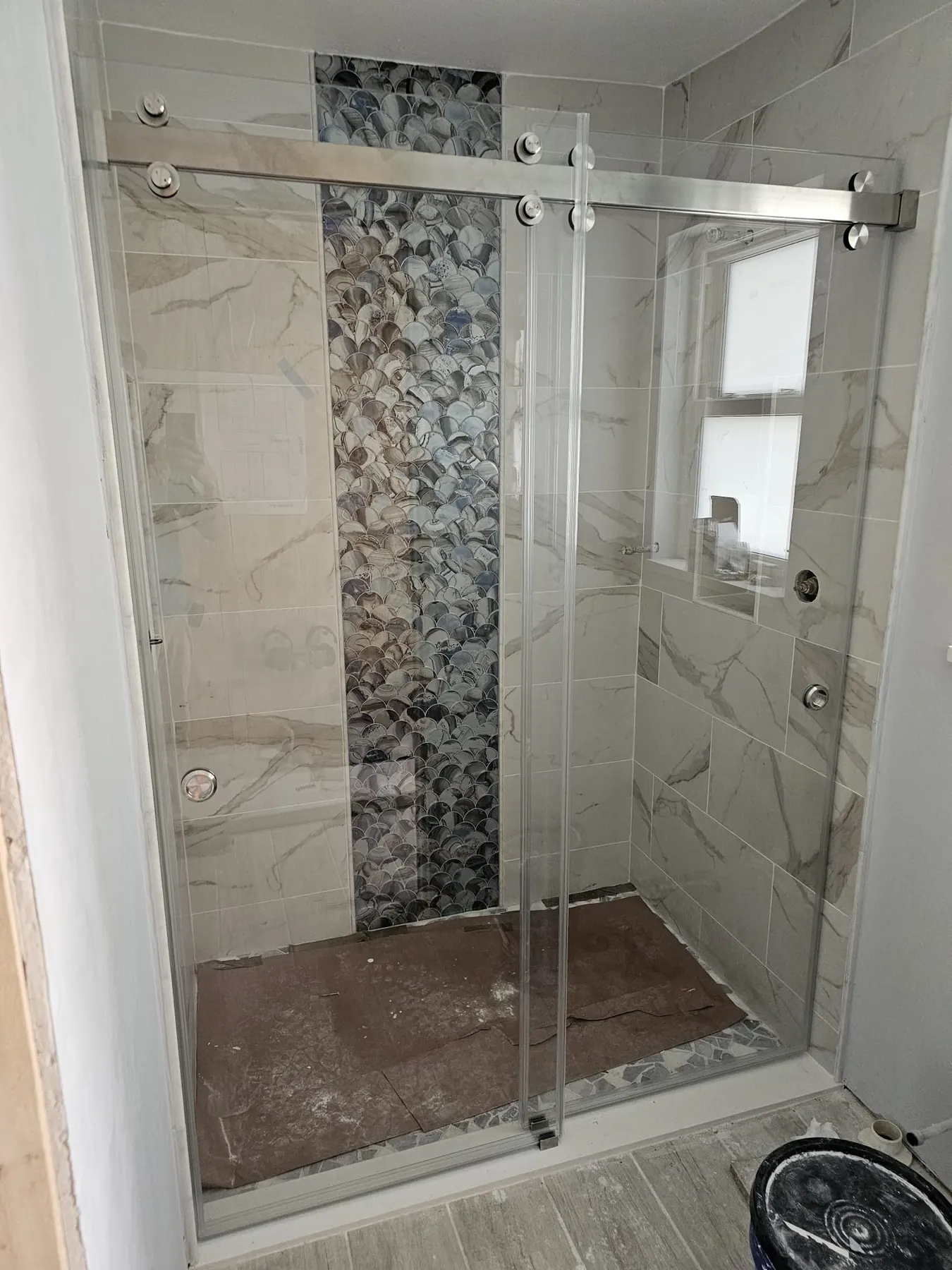 after frameless sliding shower glass with chrome hardware in Southwest Florida