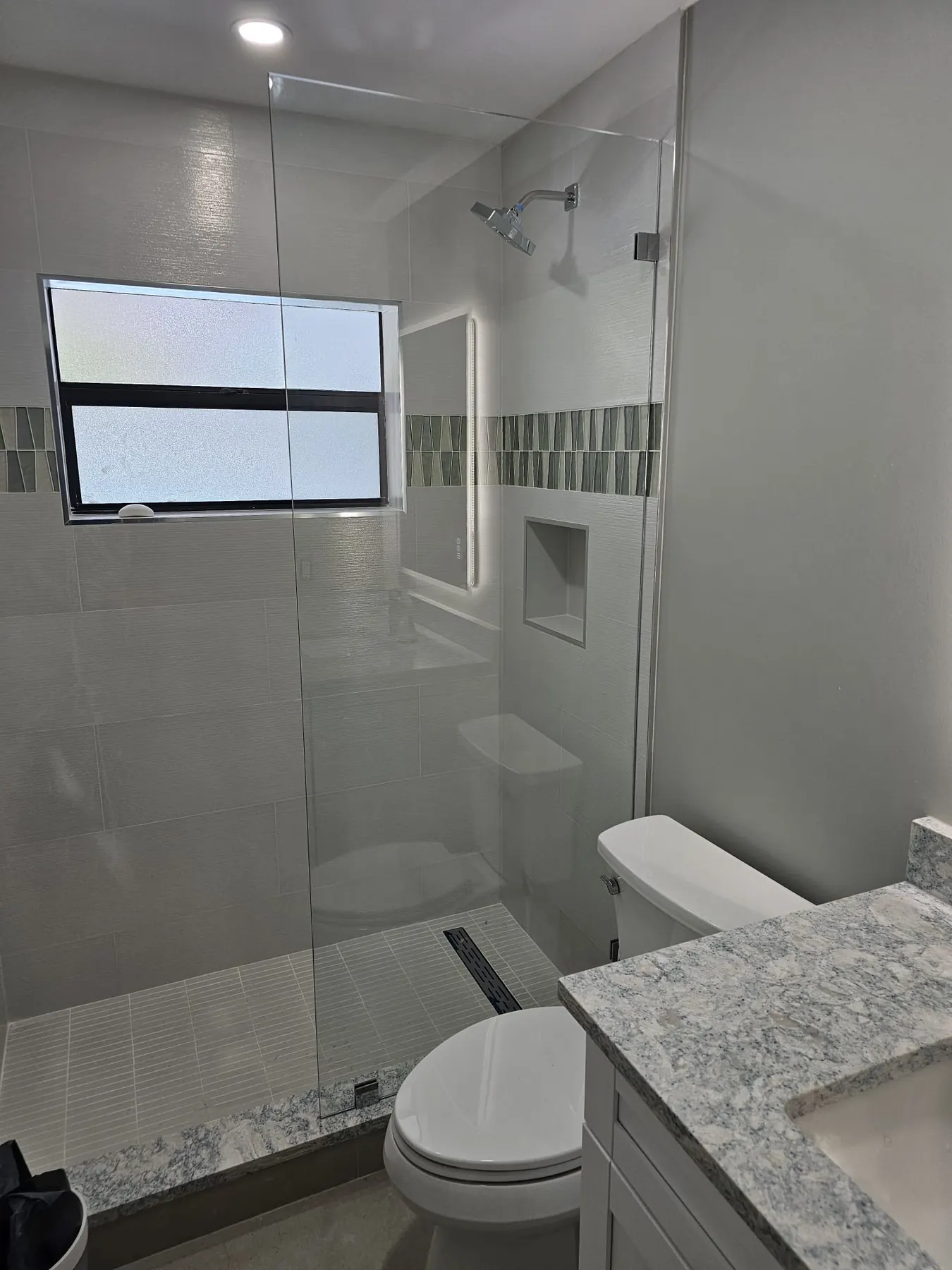 after frameless shower glass with chrome hardware in Southwest Florida