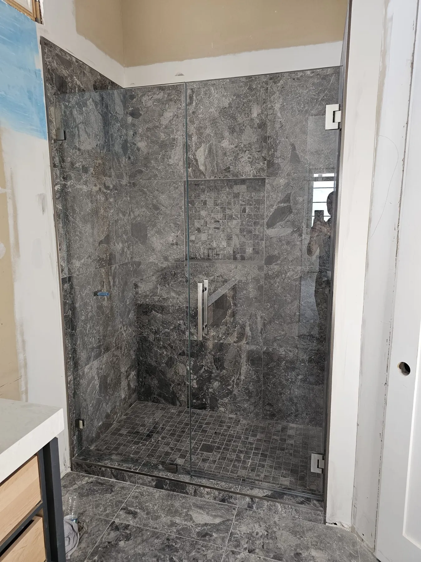 after frameless swing shower glass with chrome hardware in Southwest Florida
