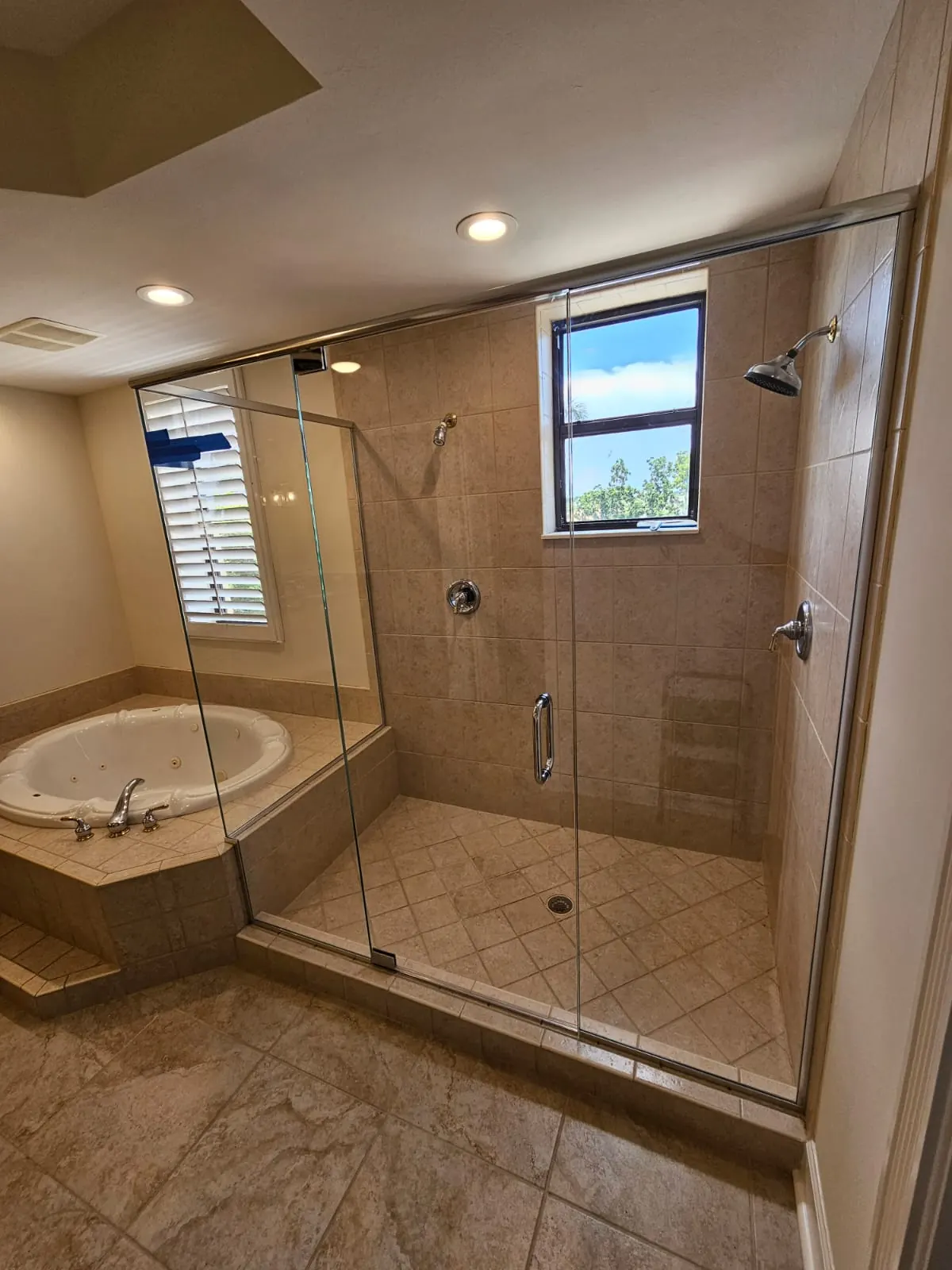 after frameless swing shower glass with chrome hardware in Southwest Florida