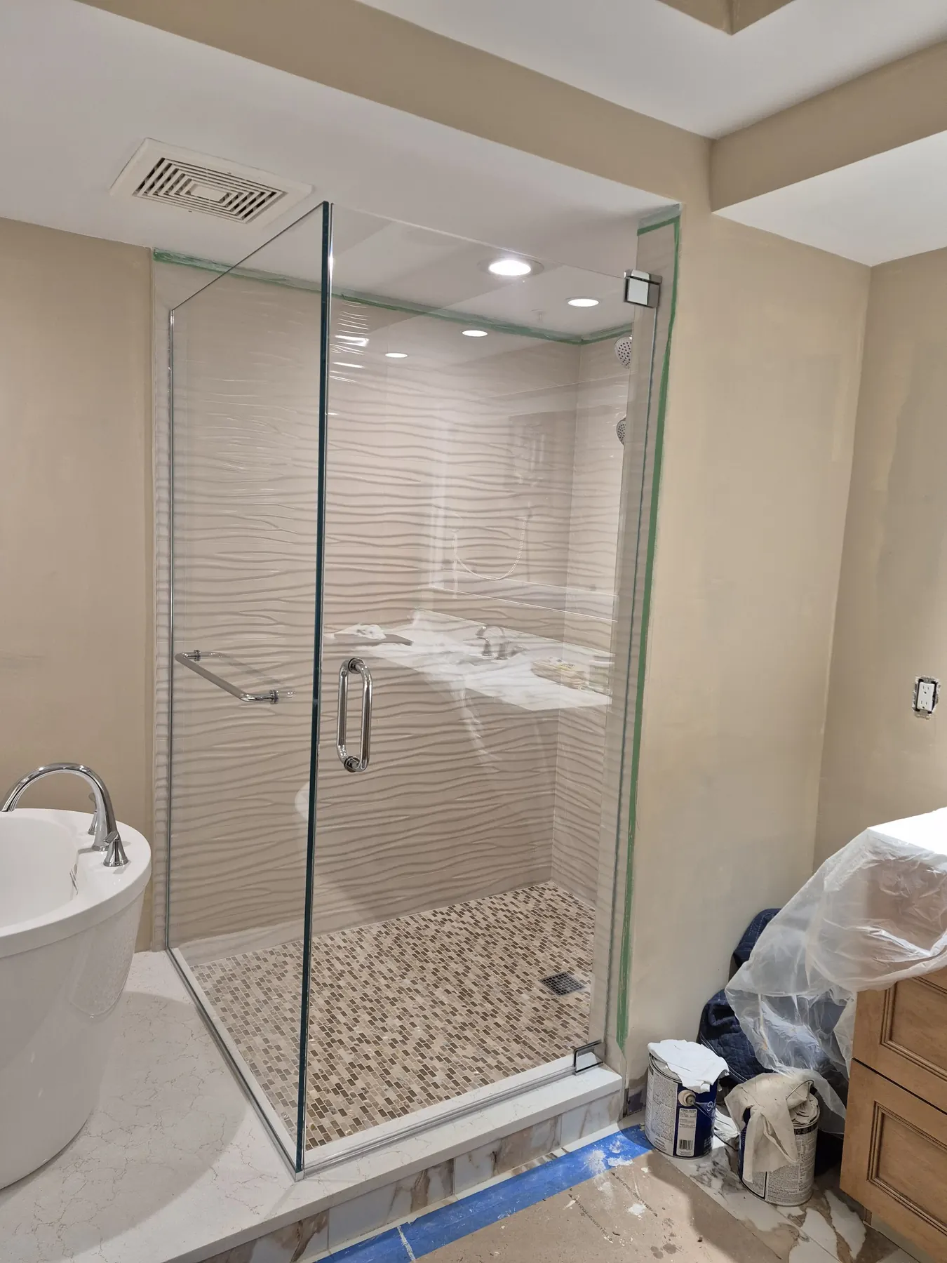 after frameless swing shower glass with chrome hardware in Southwest Florida