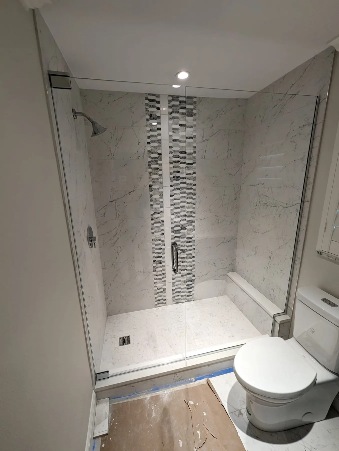 after frameless swing shower glass with chrome hardware in Southwest Florida