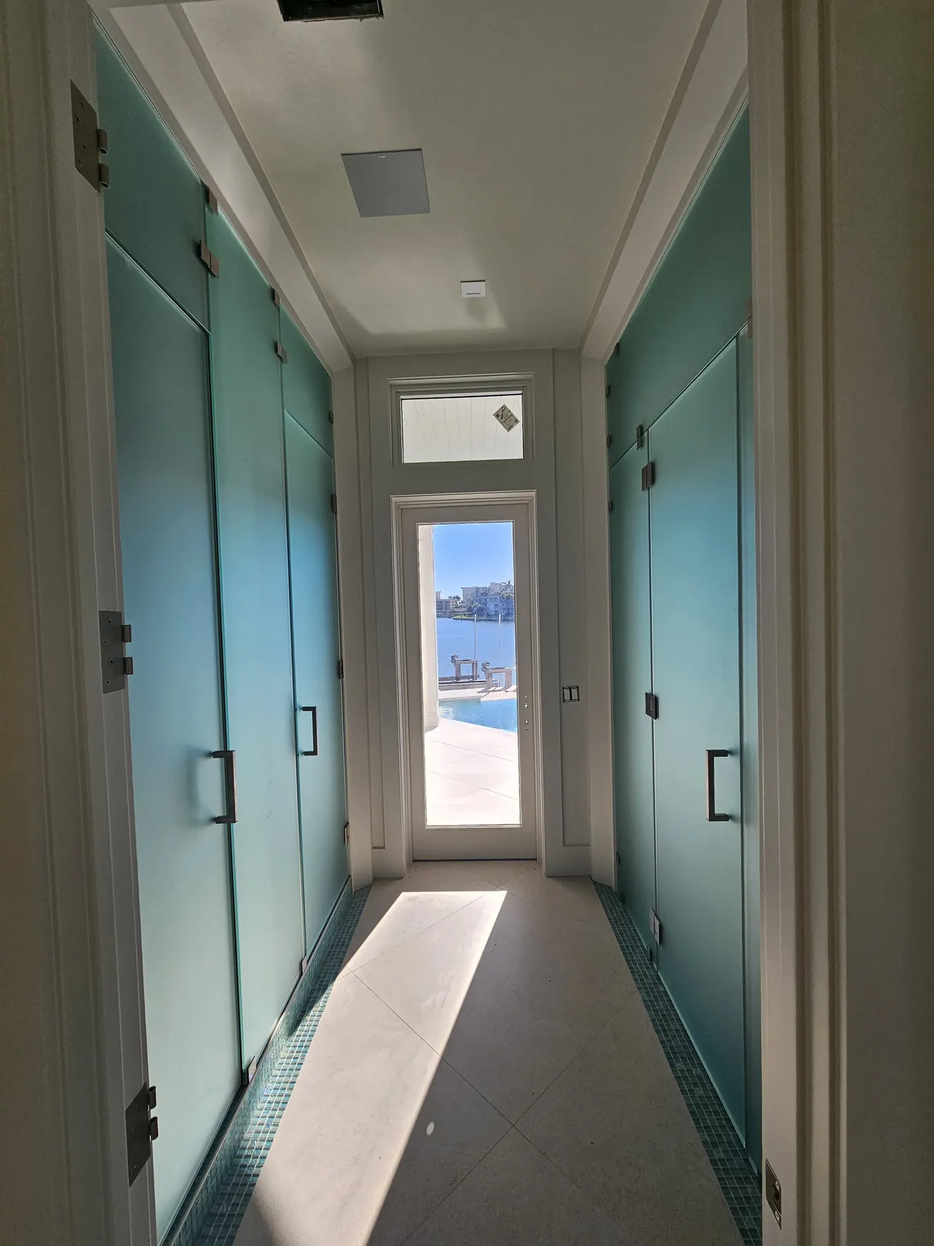 after frameless swing shower glass with brushed nickel hardware in Southwest Florida