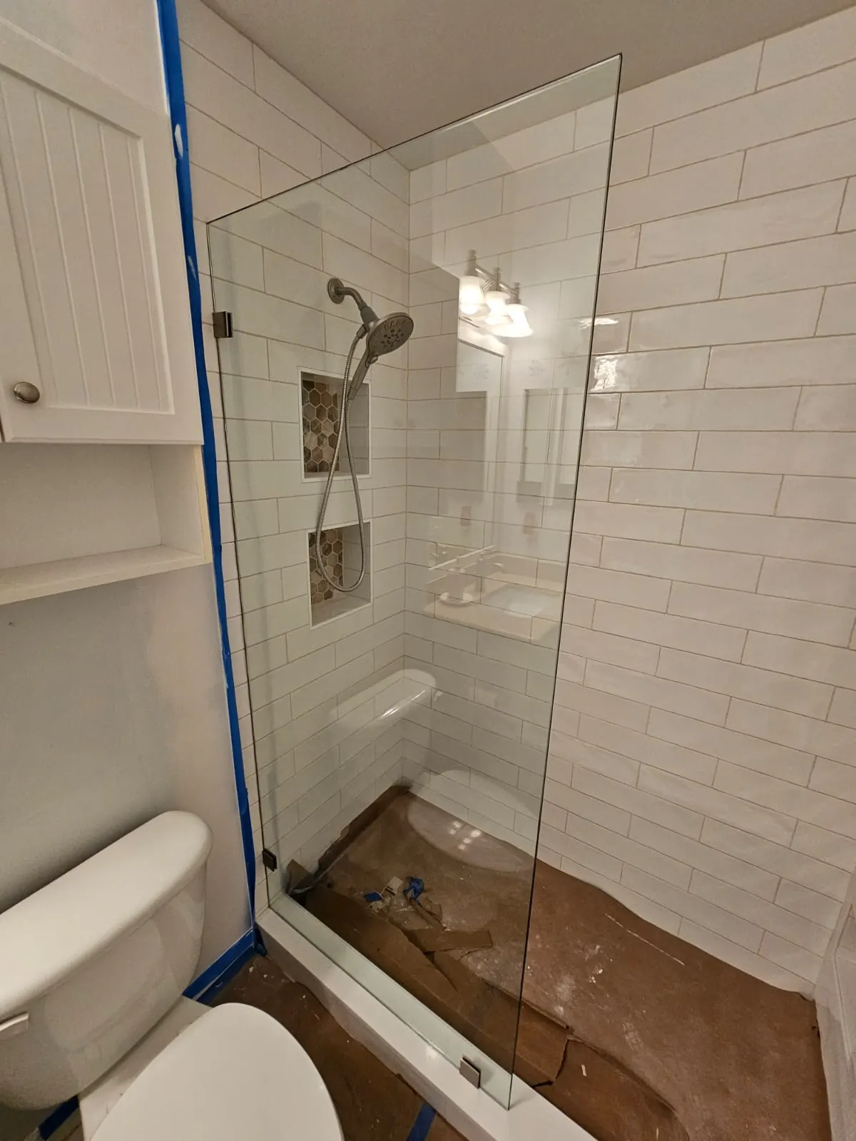 after frameless shower glass with brushed nickel hardware in Southwest Florida